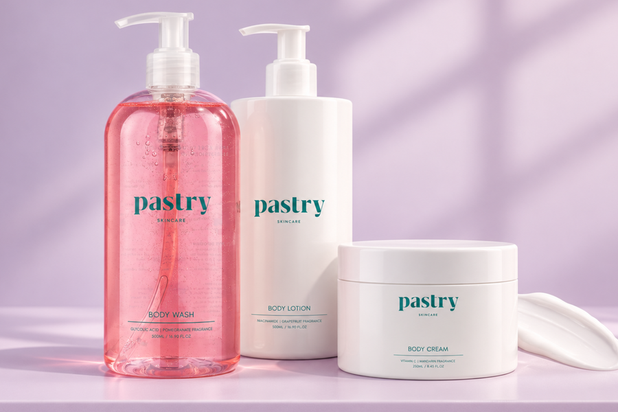 Pastry Hyperpigmentation collection featuring Glycolic Acid Body Wash, Niacinamide Body Lotion, Vitamin C Body Cream on a pale lavender background