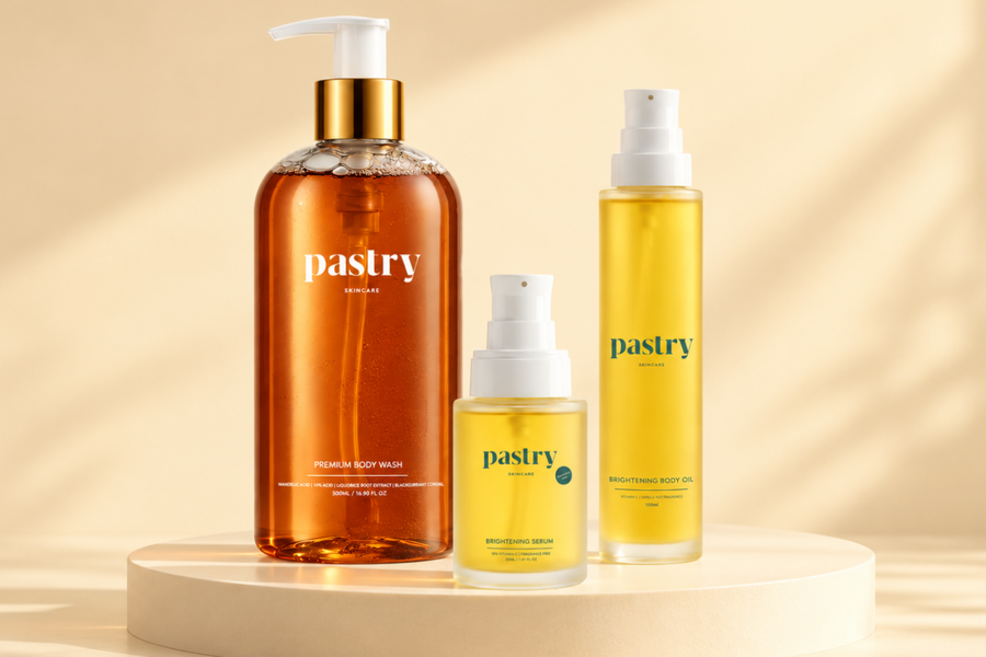 Pastry Brightening collection featuring Mandelic Acid Body Wash, Brightening Body Oil - Vanilla Nut, Brightening Serum – 10% Vitamin C on a pale butter background